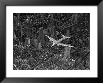Aerial View Of A Dc-4 Passenger Plane Flying Over Midtown Manhattan by Margaret Bourke-White Pricing Limited Edition Print image