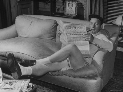 Actor/Singer Bing Crosby, Reading Paper At Home by John Florea Pricing Limited Edition Print image