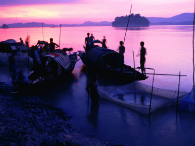 Sunset Over Fishermen On Banks Of Brahmaputra River, Guwahati, Assam, India by Greg Elms Pricing Limited Edition Print image