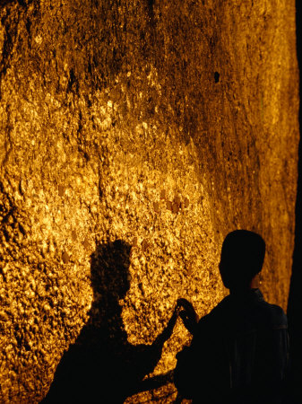 Pilgrim Fixes Gold Leaf To Surface Of Balancing Boulder, Kyaiktiyo, Myanmar (Burma) by Corey Wise Pricing Limited Edition Print image