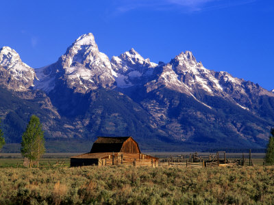 Morning Light On The Tetons And Old Barn, Grand Teton National Park, Wyoming, Usa by Howie Garber Pricing Limited Edition Print image