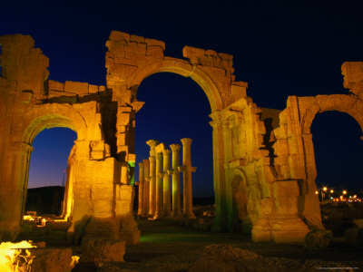 Floodlit Monumental Arch Marking The Entrance To Palmyra, Tadmor District, Palmyra, Syria by Mark Daffey Pricing Limited Edition Print image