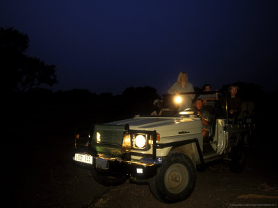 Night Game Drive, Kulefu Camp, Zambia by Roger De La Harpe Pricing Limited Edition Print image