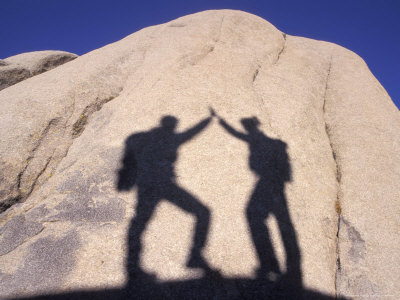 High-Fiving Shadows On A Rock by Fogstock Llc Pricing Limited Edition Print image