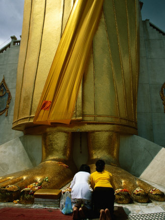 Worshippers At Feet Of Standing Buddha Figure At Wat Indraram, Bangkok, Thailand by James Marshall Pricing Limited Edition Print image