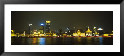 Buildings At The Waterfront Lit Up At Night, Pudong, Huangpu River, Shanghai, China by Panoramic Images Pricing Limited Edition Print image