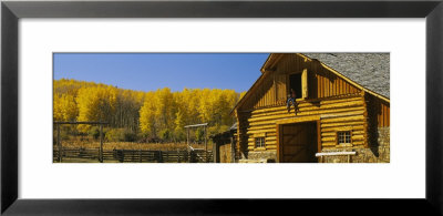 Cowboy Sitting On A Window Of A Log Cabin, Ouray County, Ridgeway, Colorado, Usa by Panoramic Images Pricing Limited Edition Print image
