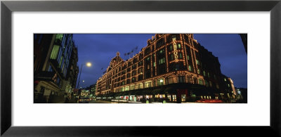 Buildings Lit Up At Night, Harrods, London, England by Panoramic Images Pricing Limited Edition Print image