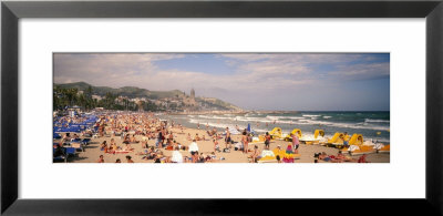 Tourists On The Beach, Sitges, Spain by Panoramic Images Pricing Limited Edition Print image