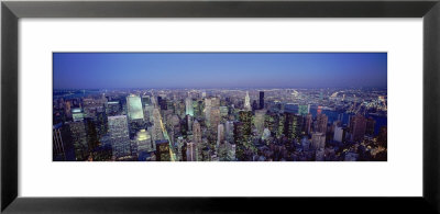 Buildings Lit Up In A City, New York, Usa by Panoramic Images Pricing Limited Edition Print image