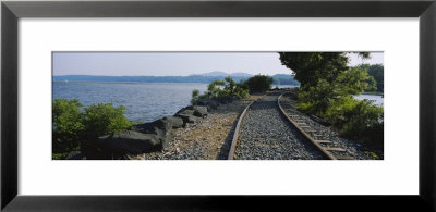 Railroad Track Along A River, Hudson River, Kingston, New York State, Usa by Panoramic Images Pricing Limited Edition Print image