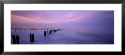 Wooden Posts In Water, Sandsend, Yorkshire, England, United Kingdom by Panoramic Images Pricing Limited Edition Print image