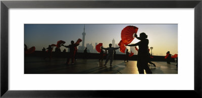 Silhouette Of A Group Of People Dancing In Front Of Pudong, The Bund, Shanghai, China by Panoramic Images Pricing Limited Edition Print image