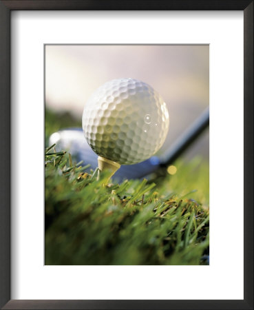 Golf Ball On Wooden Tee With Driver In Background by Eric Kamp Pricing Limited Edition Print image