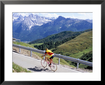 Cyclist Riding Over Sella Pass, 2244M, Dolomites, Alto Adige, Italy by Richard Nebesky Pricing Limited Edition Print image