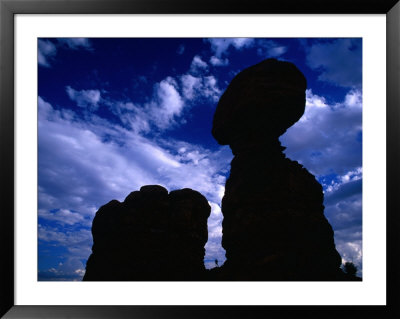 Hiker Dwarfed By Balanced Rock, Arches National Park, Utah, Usa by Gareth Mccormack Pricing Limited Edition Print image