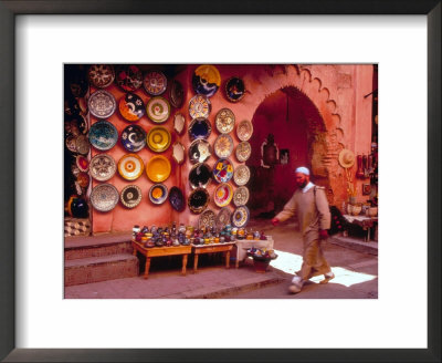Muslim Man Walks By Wall Of Moroccan Pottery, Marrakech, Morocco by John & Lisa Merrill Pricing Limited Edition Print image