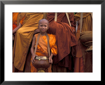 Monk With Alms Wok At That Luang Festival, Laos by Keren Su Pricing Limited Edition Print image