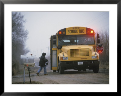 A Student Boards A School Bus In The Morning Fog by Joel Sartore Pricing Limited Edition Print image