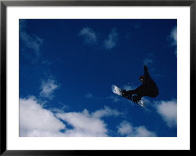 A Snowboarder Launches In The Air And Appears For A Second To Be Riding The Clouds by Barry Tessman Pricing Limited Edition Print image