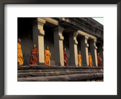 Monks Behind The Columns Of The Gallery At Angkor Wat, Siem Reap, Cambodia by Keren Su Pricing Limited Edition Print image