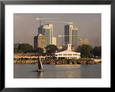 Fishing Dhow In Front Of Fish Market With Skyscrapers Behind, Dar Es Salaam, Tanzania by Ariadne Van Zandbergen Pricing Limited Edition Print image