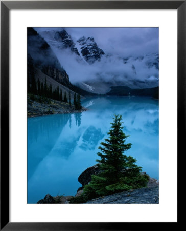 View Of Moraine Lake With Low-Lying Clouds At One End by Raymond Gehman Pricing Limited Edition Print image