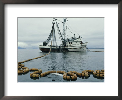 A Fishing Boat With A Large Net In The Water by Robert Sisson Pricing Limited Edition Print image
