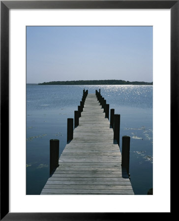 View On A Clear Summer Day Of A Dock Extending Out Into A Bay by Taylor S. Kennedy Pricing Limited Edition Print image