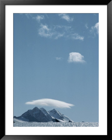 A View Across A Glacier Of Mount Fordell, Capped By A Cloud by Gordon Wiltsie Pricing Limited Edition Print image