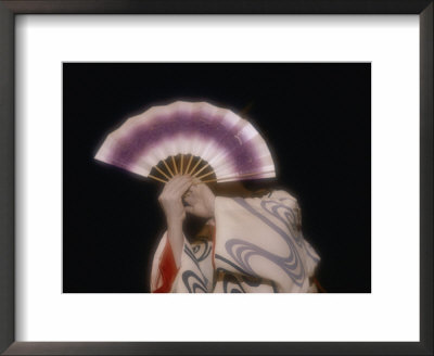 An Geisha Holds A Fan In Front Of Her Face During A Formal Ceremony by Paul Chesley Pricing Limited Edition Print image