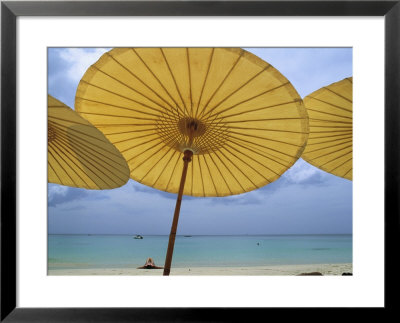 Beach From Underneath Yellow Umbrellas At The Amanpuri Hotel by Jodi Cobb Pricing Limited Edition Print image