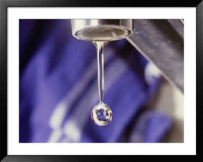 A Close-Up Of A Faucet With A Single Drop Of Water Coming Out Of It by Todd Gipstein Pricing Limited Edition Print image