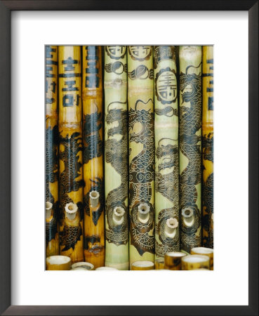 Close View Of Bamboo Pipes Bearing Designs Of Dragons by Steve Raymer Pricing Limited Edition Print image