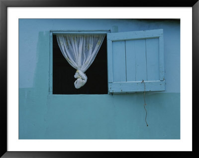 A Knotted Curtain Hangs In An Open Window On A Blue House by Michael Melford Pricing Limited Edition Print image