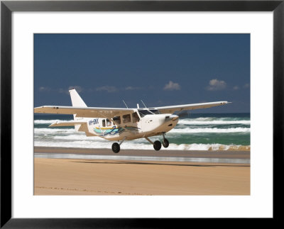 Plane About To Land On Seventy Five Mile Beach, Queensland, Australia by David Wall Pricing Limited Edition Print image