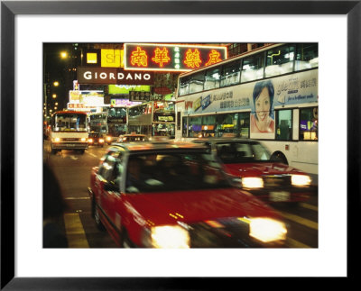 Kowloon Street Scene At Night With Neon Signs, Buses, And Taxis by Eightfish Pricing Limited Edition Print image