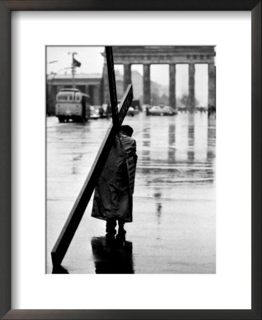 Man Carrying Cross, Berlin, October 1961 by Toni Frissell Pricing Limited Edition Print image