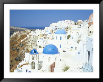 Oia With Blue Domed Churches And Whitewashed Buildings, Santorini (Thira), Cyclades Islands, Greece by Lee Frost Pricing Limited Edition Print image