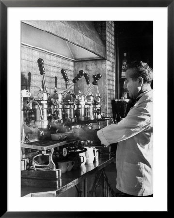 Waiter Using Espresso Machine In Restaurant At Cafe Partenopea by Fred Lyon Pricing Limited Edition Print image