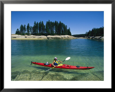 Woman Kayaks Through The Clear Water Of Penobscot Bay, Maine by Skip Brown Pricing Limited Edition Print image