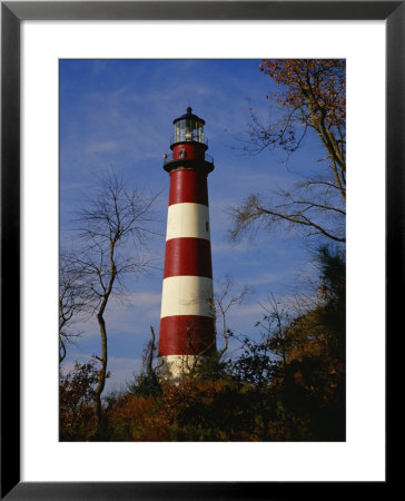 The Assateague Island Lighthouse Against A Blue Sky by Raymond Gehman Pricing Limited Edition Print image