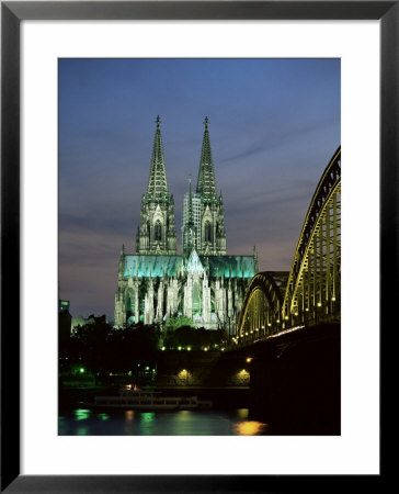 Cologne Cathedral, And Hohenzollern Bridge At Night, North Rhine Westphalia by Yadid Levy Pricing Limited Edition Print image