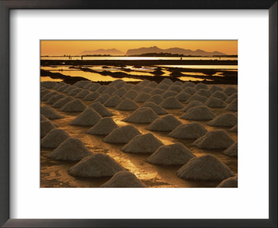 Sun Setting Over Mounds Of Salt Drying On Saltpans, Mothia, San Pantaleo, Sicily, Italy by Dallas Stribley Pricing Limited Edition Print image