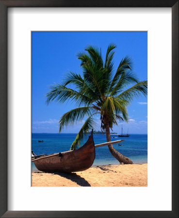 Outrigger On Nosy Komba Beach,Nosy Komba,Antsiranana, Madagascar by Carol Polich Pricing Limited Edition Print image