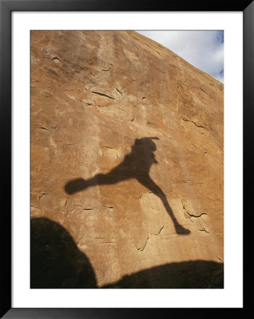 A Hikers Shadow On A Sandstone Wall by Dugald Bremner Pricing Limited Edition Print image