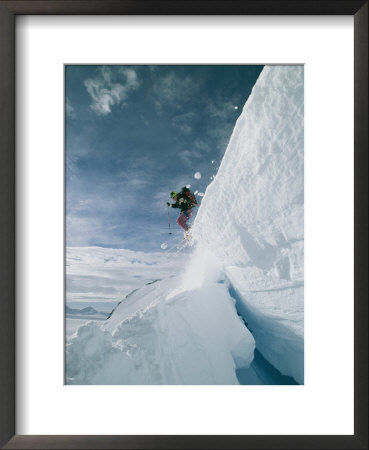 A Skier Leaps A Large Crevasse In Calley Glacier by Gordon Wiltsie Pricing Limited Edition Print image
