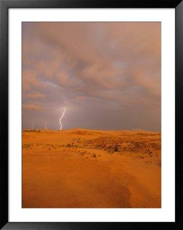 A Bolt Of Lightning Strikes The Sand Dune Landscape by Skip Brown Pricing Limited Edition Print image
