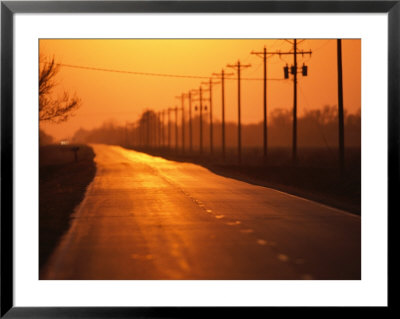 A Country Highway Fades Into The Sunset Near Wood River, Nebraska by Joel Sartore Pricing Limited Edition Print image