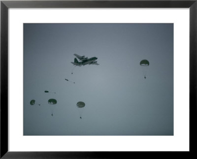 Soldiers Parachute From A Plane During A Training Exercise by Lowell Georgia Pricing Limited Edition Print image